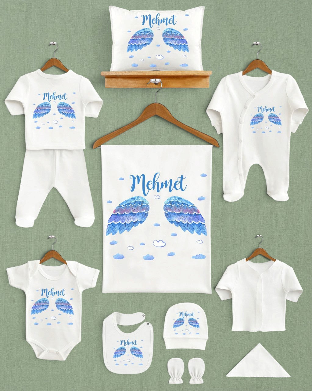 Mağazam Angel Baby Desing ekru renkli, mavi kanat desenli ve isme özel 11 parça organik pamuklu yenidoğan seti